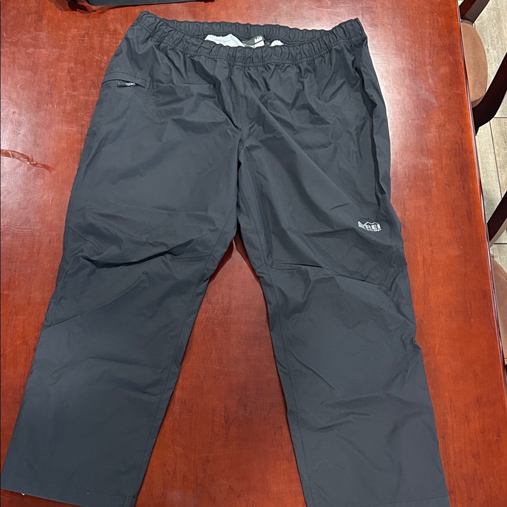 Men's Black REI Co-op rain pants with jacket